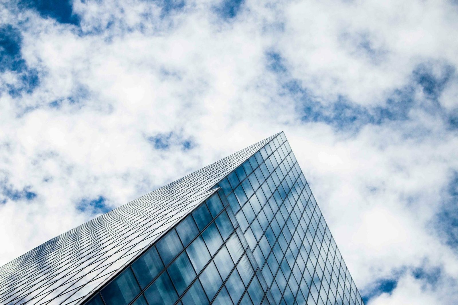 Modern office building rising against an open sky.